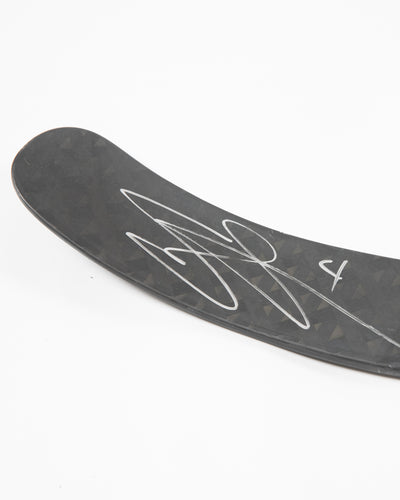 Autographed Chicago Blackhawks Seth Jones game used hockey stick - close up on signature