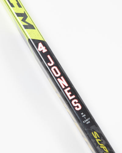 Autographed Chicago Blackhawks Seth Jones game used hockey stick - close up on player label