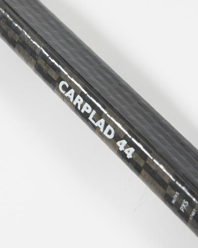 Autographed Chicago Blackhawks Calvin de Haan game used hockey stick - close up of player label