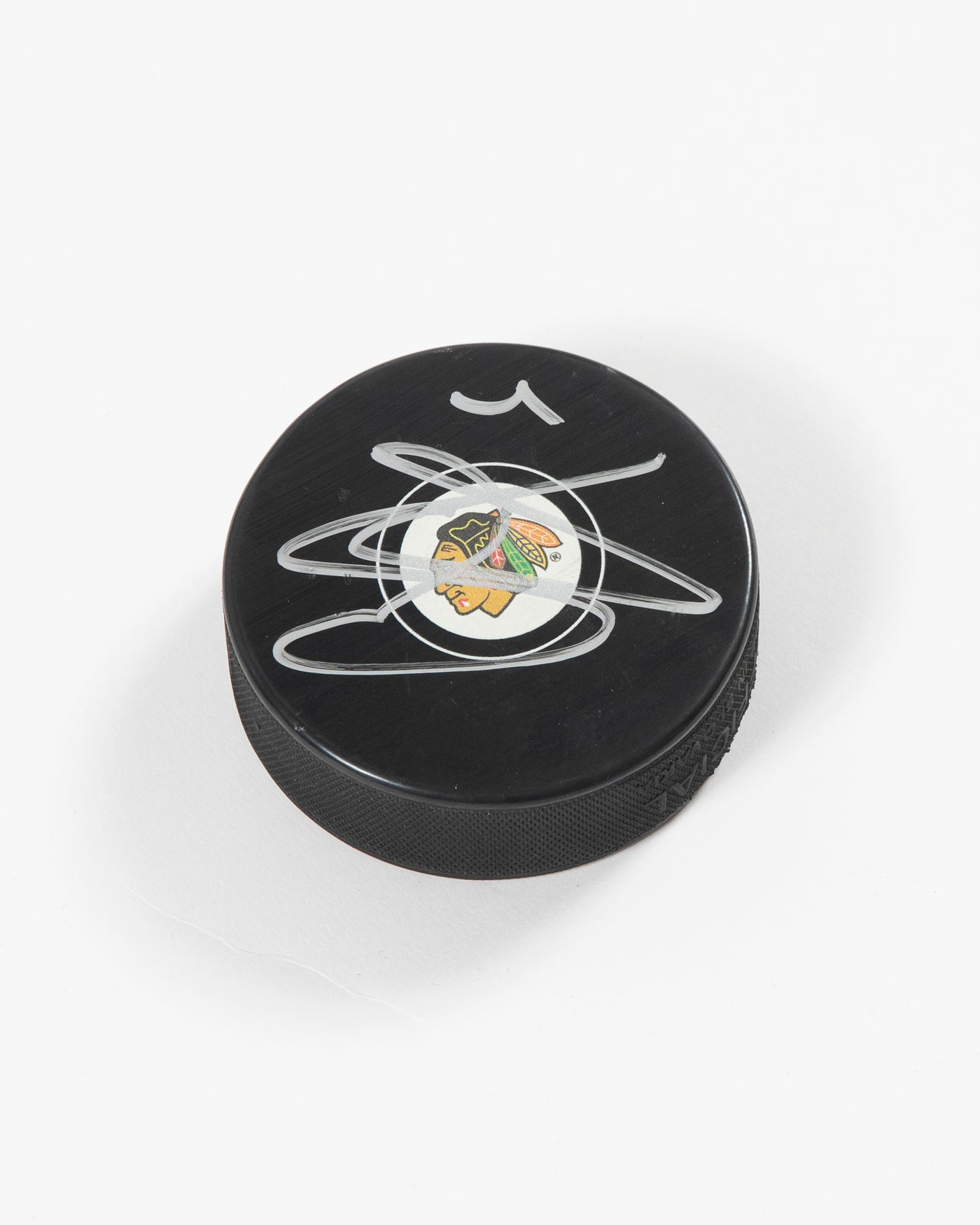 Signed Chicago Blackhawks Seth Jones hockey puck - side angle