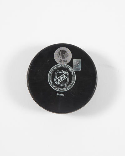 Signed Chicago Blackhawks Seth Jones hockey puck - close up of hologram sticker