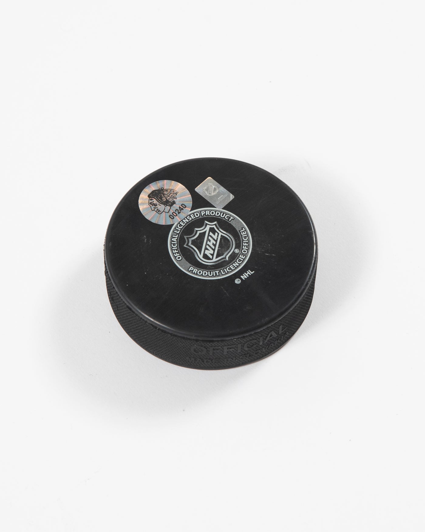 Signed Chicago Blackhawks Seth Jones hockey puck - side angle of hologram sticker