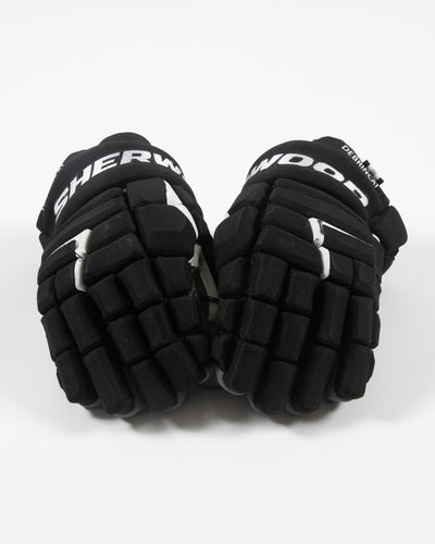 Autographed Chicago Blackhawks Sherwood Alex DeBrincat hockey gloves - both gloves front angle
