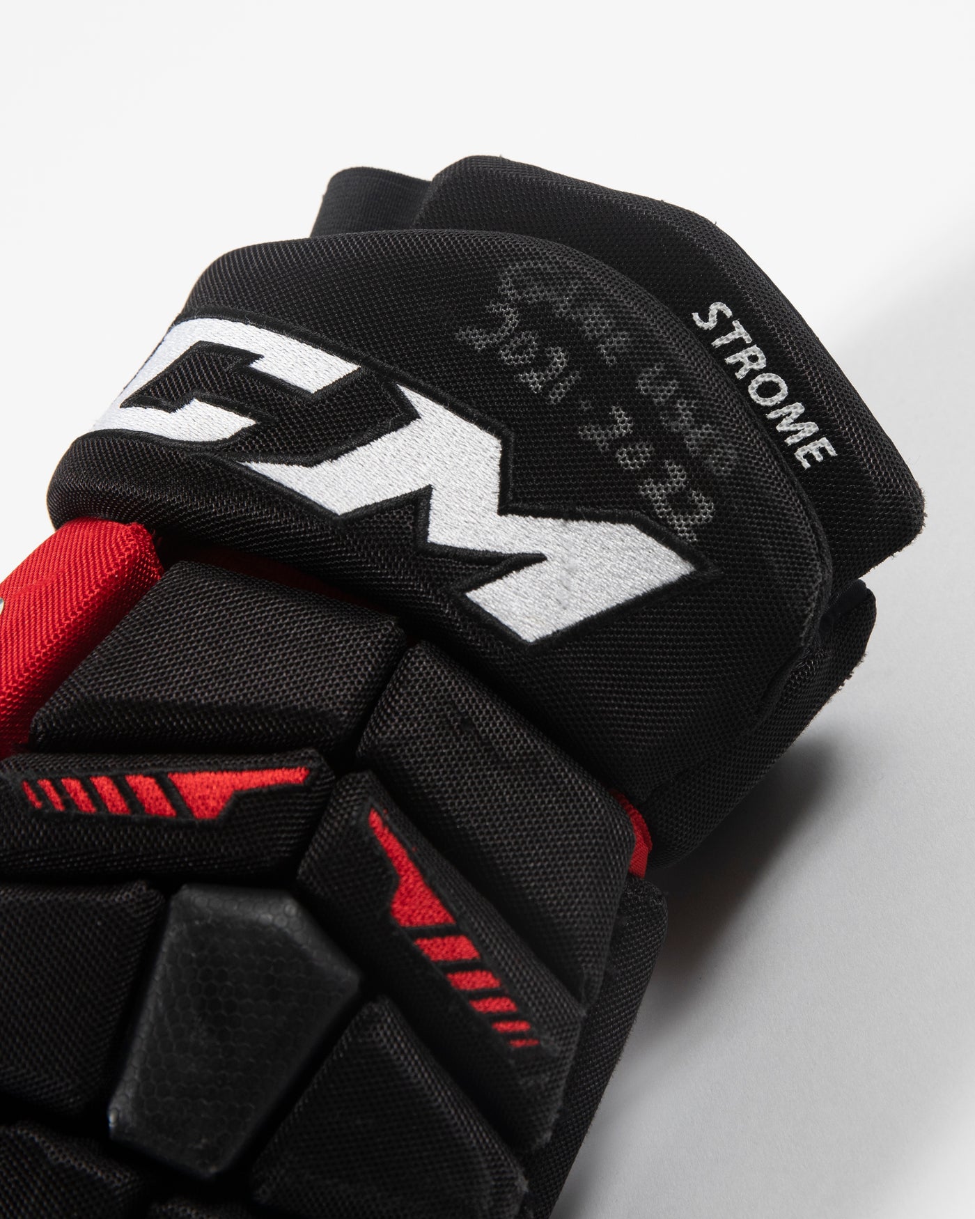 Autographed Chicago Blackhawks CCM Dylan Strome game used hockey gloves - close up of player label
