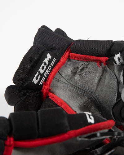 Autographed Chicago Blackhawks CCM Dylan Strome game used hockey gloves - close up of scuffs