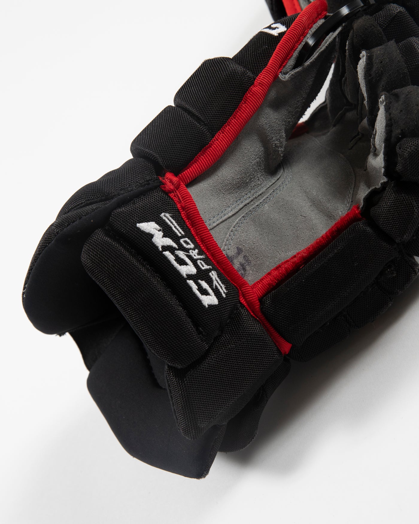 Autographed Chicago Blackhawks CCM Dylan Strome game used hockey gloves - alt close up of scuffs