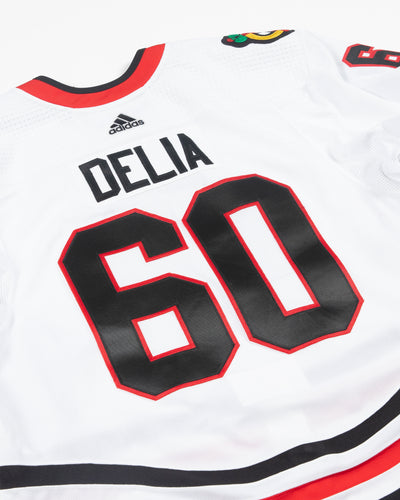Autographed Chicago Blackhawks Collin Delia team issued white jersey - alt back angle