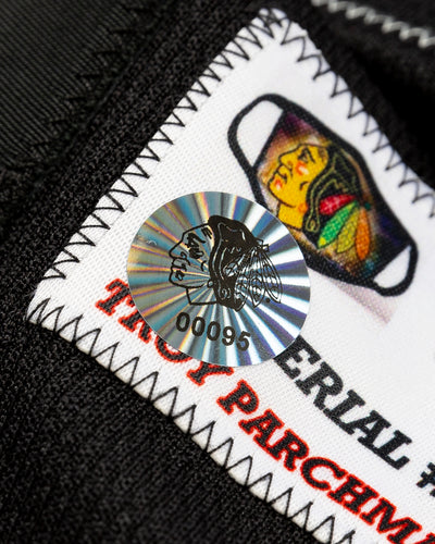 team issued Pius Suter Chicago Blackhawks alternate jersey - detail hologram sticker lay flat