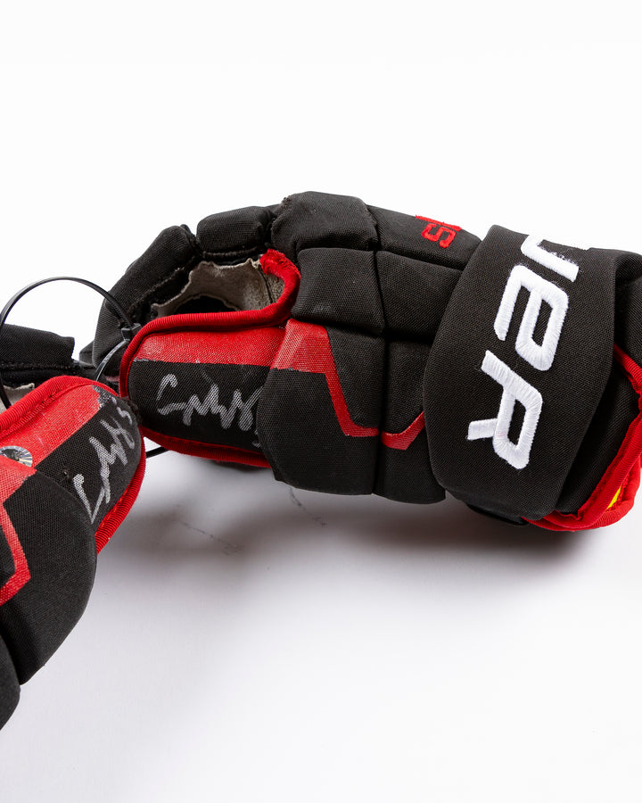 signed game-used Bauer hockey gloves from Chicago Blackhawks Connor Murphy - detail lay flat