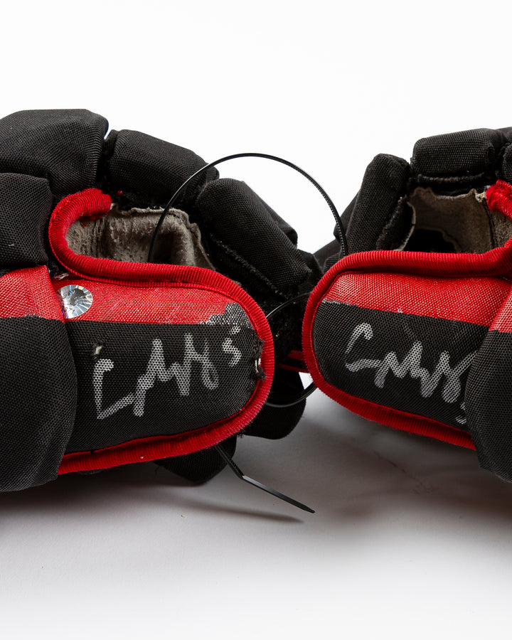 signed game-used Bauer hockey gloves from Chicago Blackhawks Connor Murphy - detail lay flat