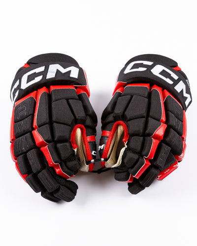 game-used Seth Jones Chicago Blackhawks CCM hockey gloves - front lay flat
