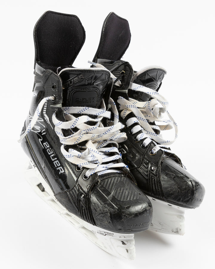 signed game-used Bauer hockey skates from Chicago Blackhawks Taylor Raddysh - front lay flat