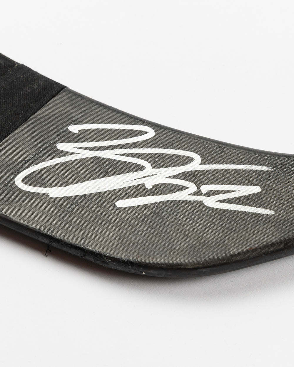 signed game-used Bauer hockey stick from Chicago Blackhawks Nikita Zaitsev - detail autograph lay flat