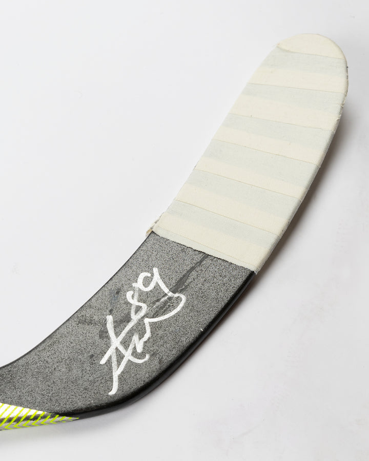 signed and game-used hockey stick from Chicago Blackhawks Andreas Athanasiou - autograph detail lay flat