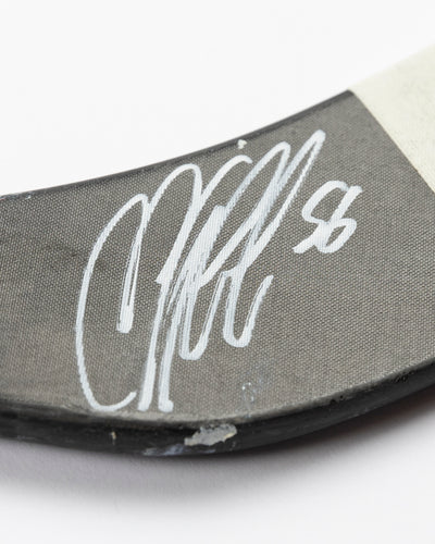 signed game-used Bauer hockey stick from former Chicago Blackahawks Erik Gustafsson - alt autograph detail lay flat