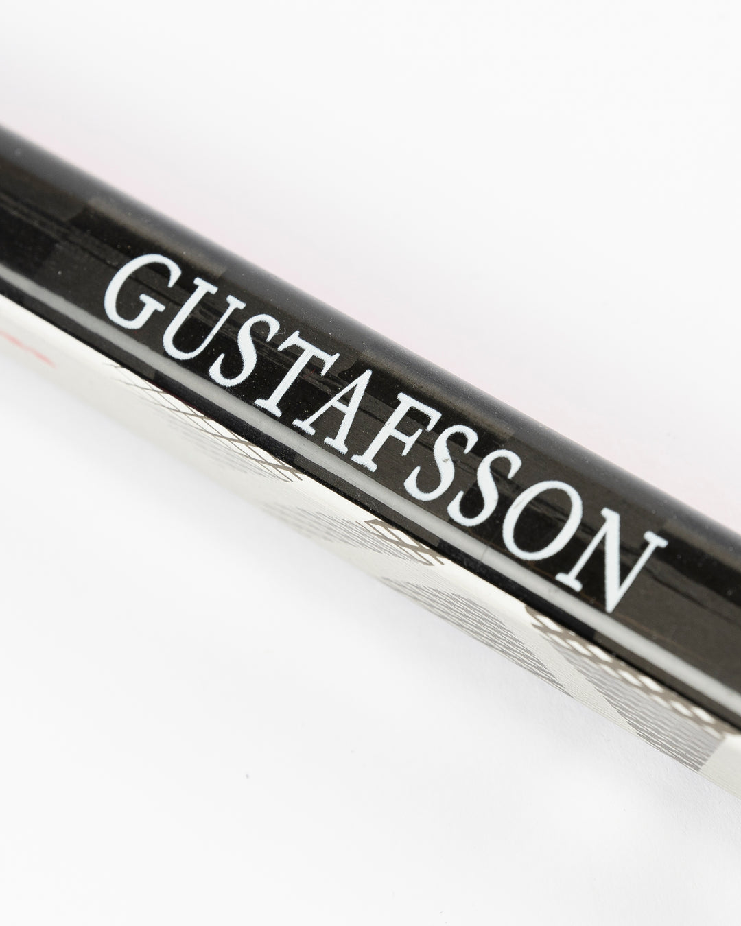 signed game-used Bauer hockey stick from former Chicago Blackahawks Erik Gustafsson - name detail lay flat