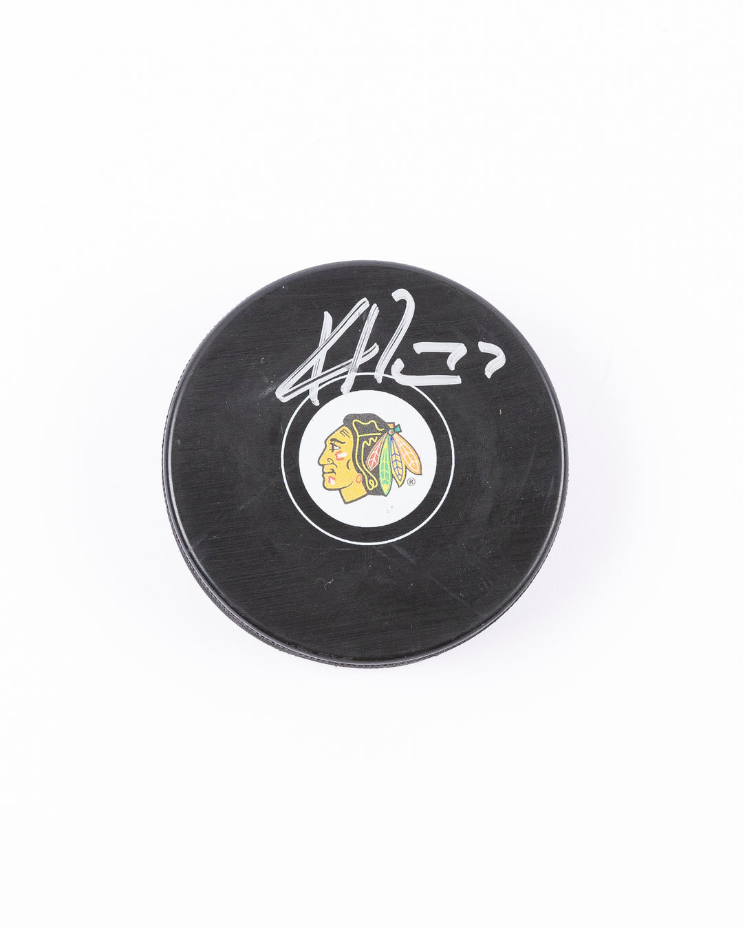 Chicago Blackhawks Kirby Dach signed puck from 2021-22 season - front lay flat