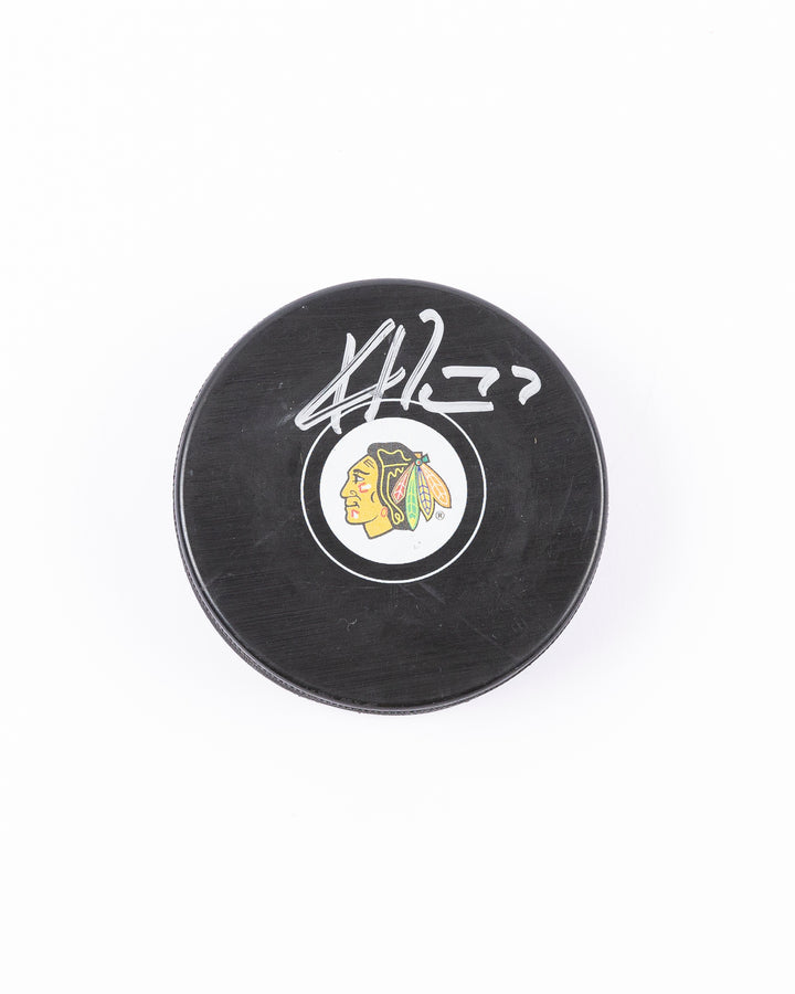 Chicago Blackhawks Kirby Dach signed puck from 2021-22 season - front lay flat