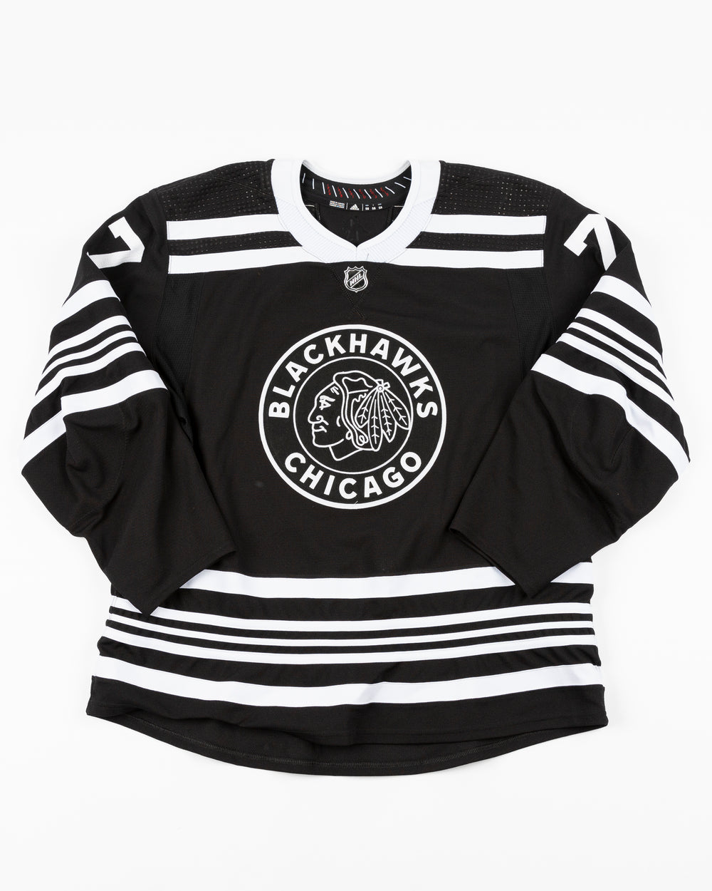 black alternate team-issued Chicago Blackhawks jersey of former player Kirby Dach - front lay flat