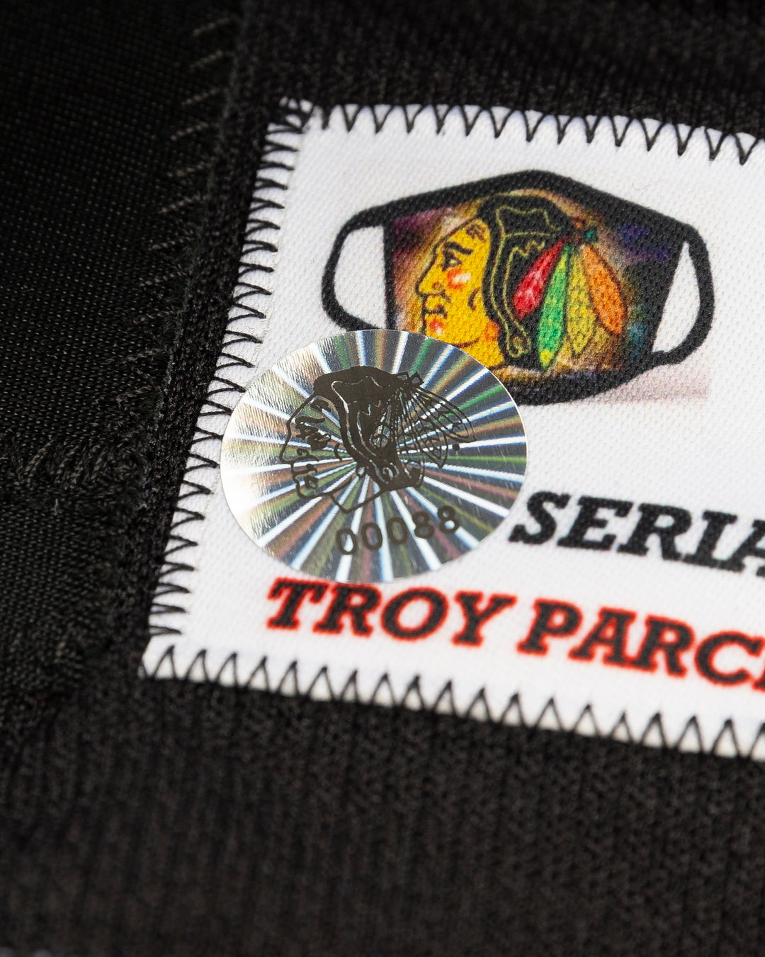 black alternate team-issued Chicago Blackhawks jersey of former player Kirby Dach - hologram sticker lay flat