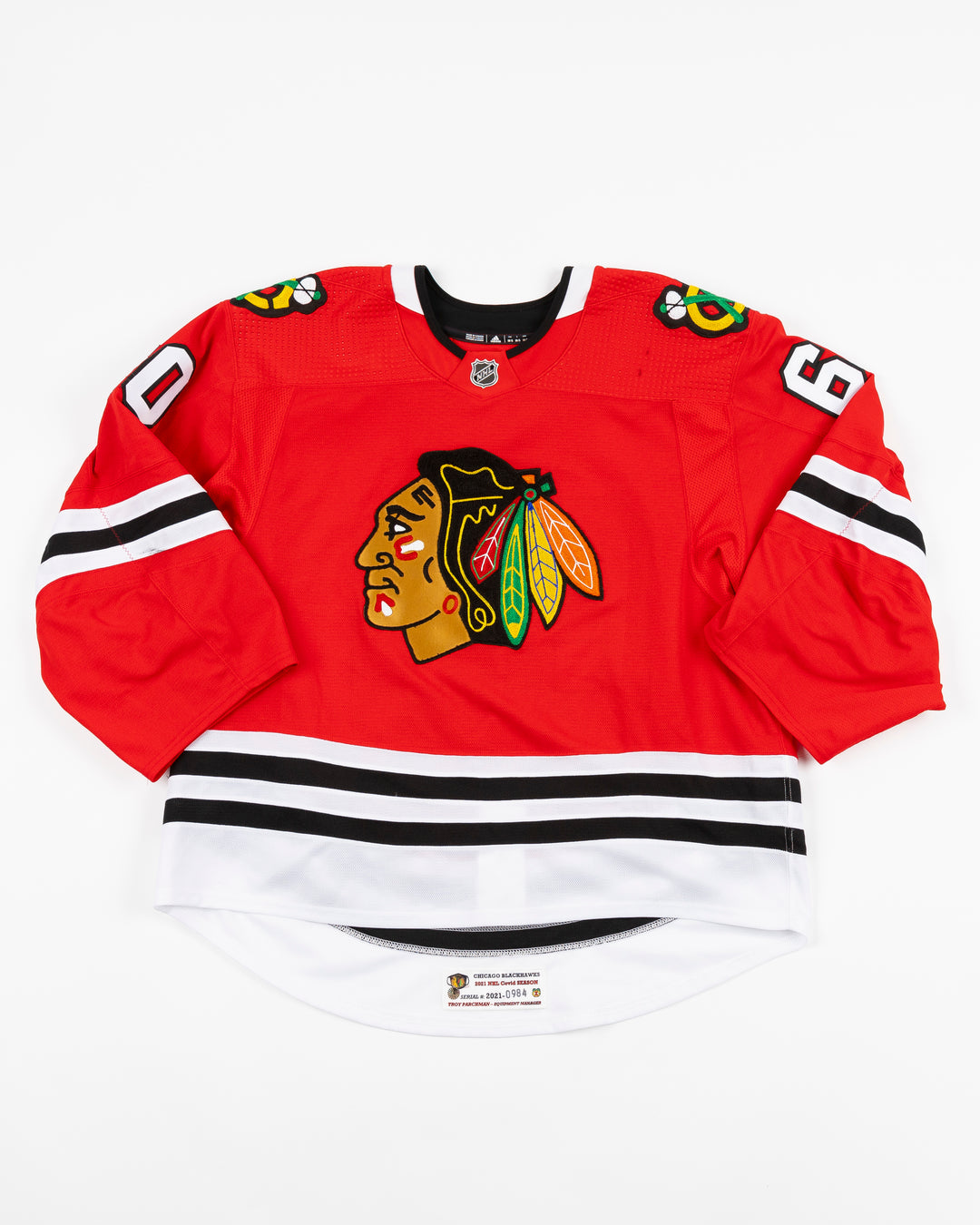 red home game-used Chicago Blackhawks jersey of Collin Delia - front lay flat