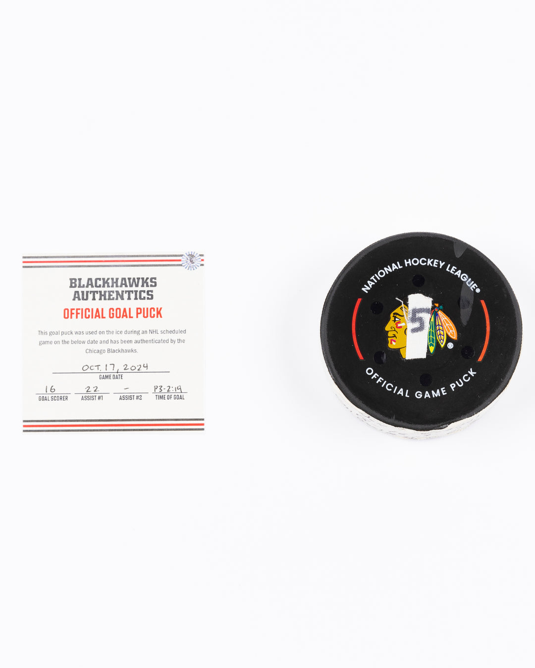 game-used hockey goal puck scored by Chicago Blackhawks player Jason Dickinson - front lay flat with certificate