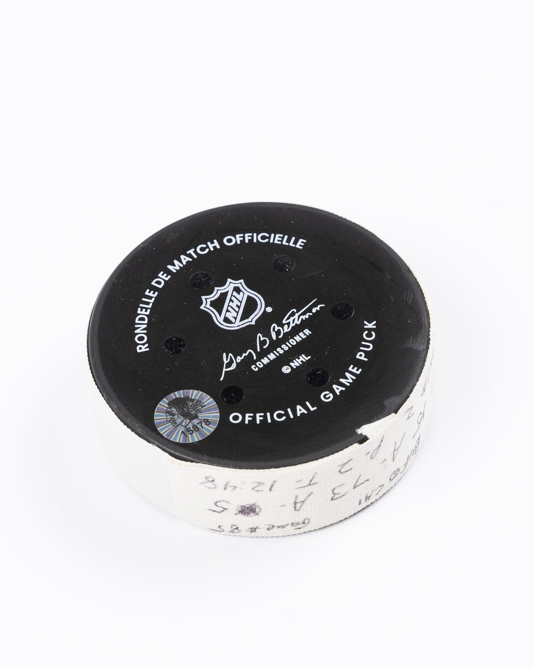 game used hockey goal puck scored by Chicago Blackhawks player Craig Smith on game on October 19, 2024 - back angled lay flat