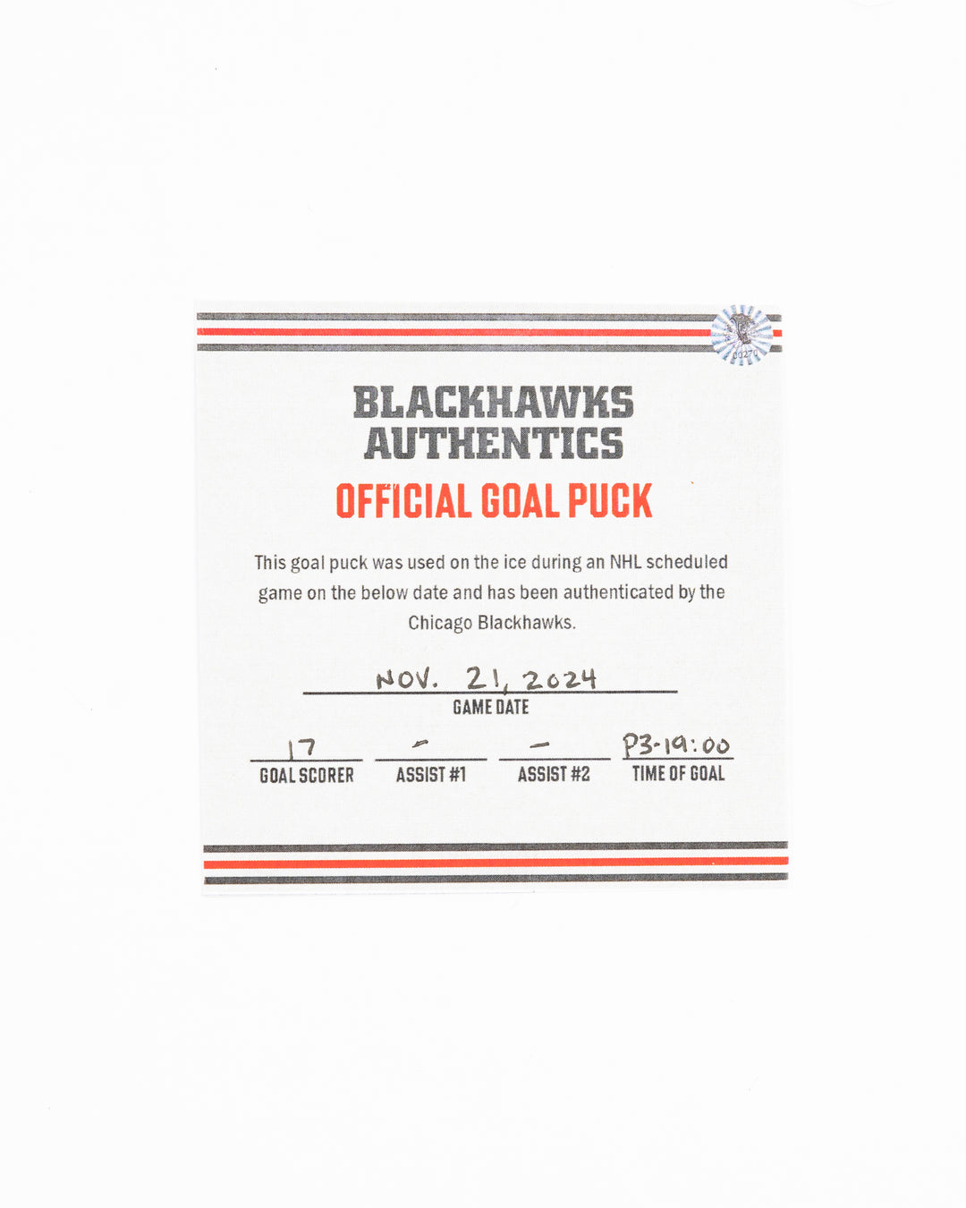 official Chicago Blackhawks hockey goal puck scored by Nick Foligno against the Florida Panthers in November 2024 - certificate front lay flat