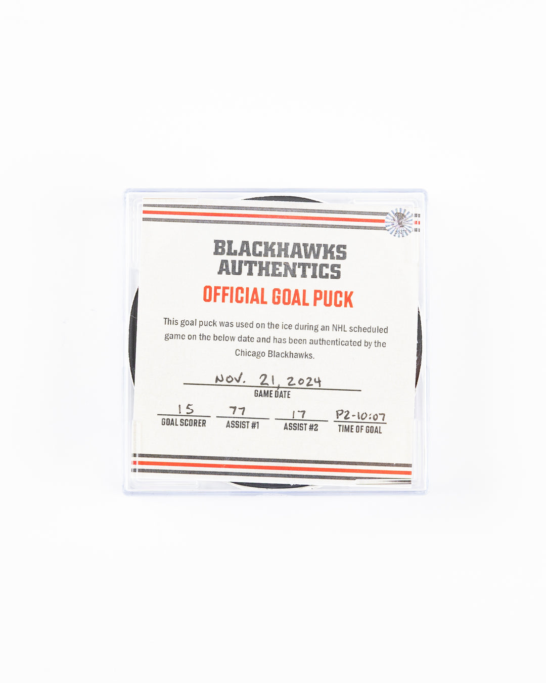 official Chicago Blackhawks hockey goal puck scored by Craig Smith against the Florida Panthers in November 2024 - front lay flat of puck in case with certificate