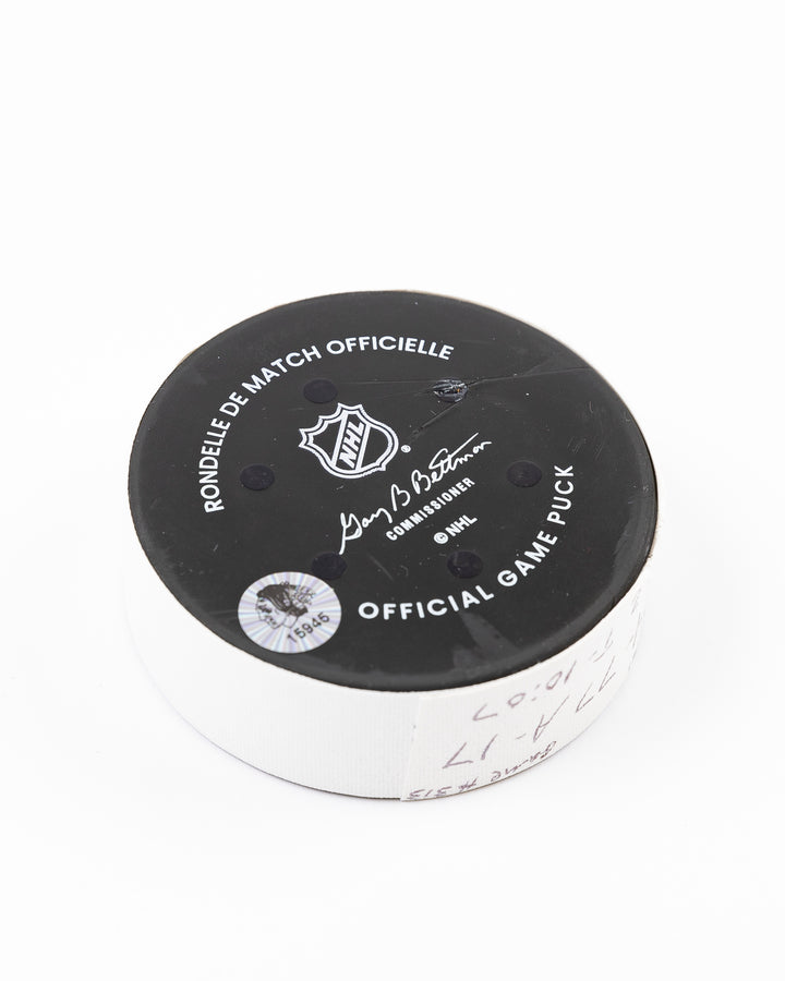 official Chicago Blackhawks hockey goal puck scored by Craig Smith against the Florida Panthers in November 2024 - back angled lay flat