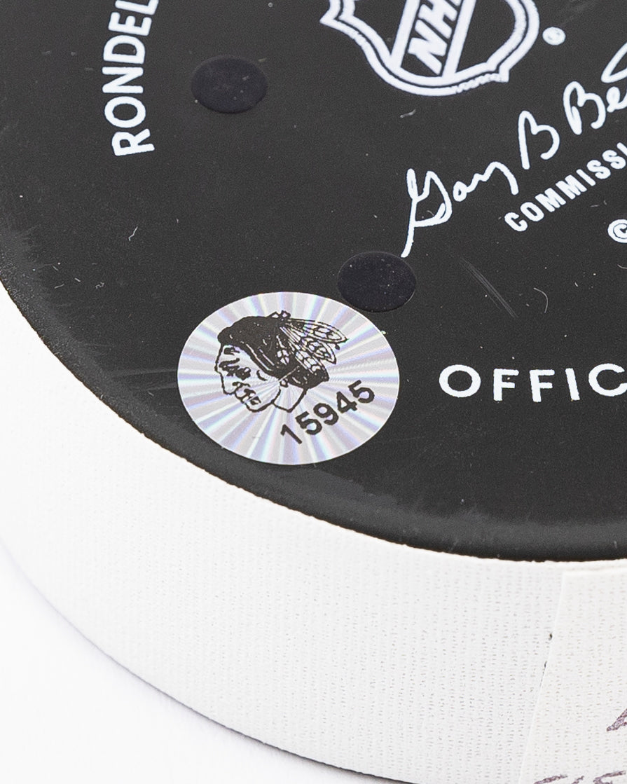 official Chicago Blackhawks hockey goal puck scored by Craig Smith against the Florida Panthers in November 2024 - hologram sticker detail lay flat