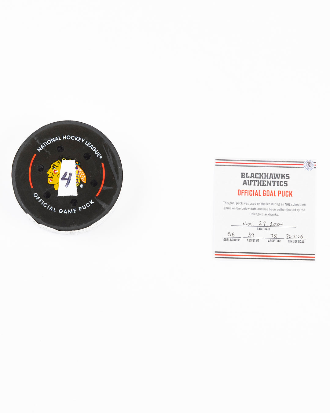 official Chicago Blackhawks hockey goal puck scored by Teuvo Teravainen against the Florida Panthers in November 2024 - front lay flat of puck and certificate