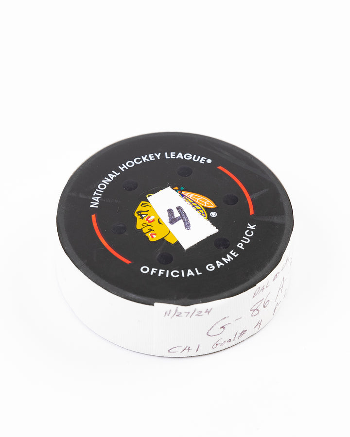 official Chicago Blackhawks hockey goal puck scored by Teuvo Teravainen against the Florida Panthers in November 2024 - front angle lay flat