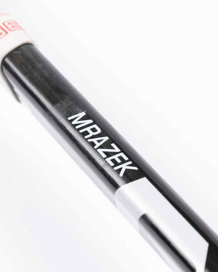 Warrior hockey stick used by Chicago Blackhawks goalie Petr Mrazek - name detail lay flat