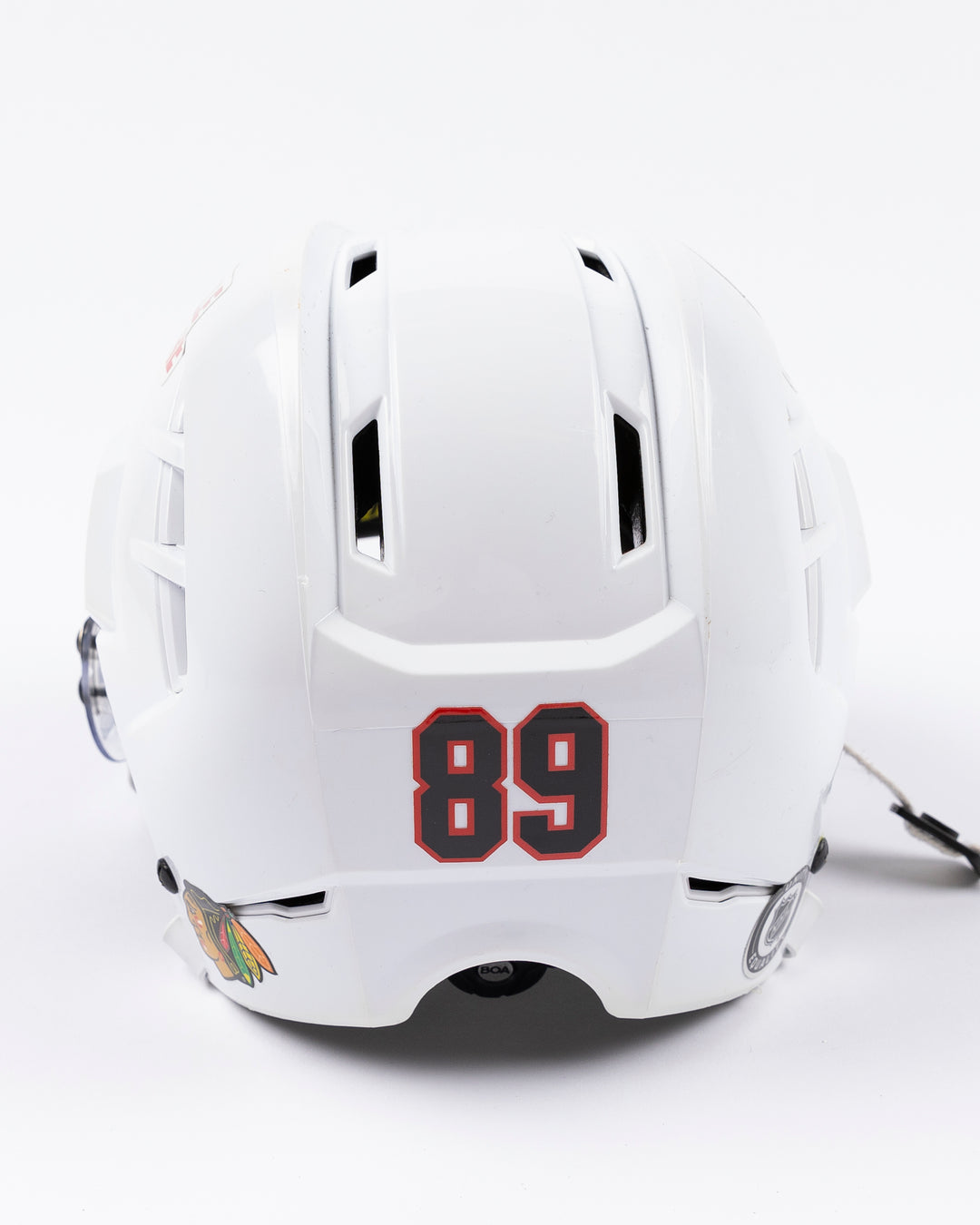 white Warrior hockey helmet worn by Chicago Blackhawks player Andreas Athanasiou - back detail lay flat