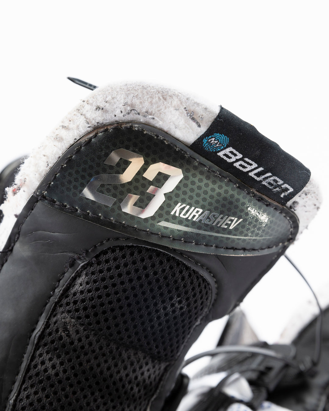 black Bauer hockey skates worn by Chicgo Blackhawks player Philipp Kurashev - name and number detail lay flat