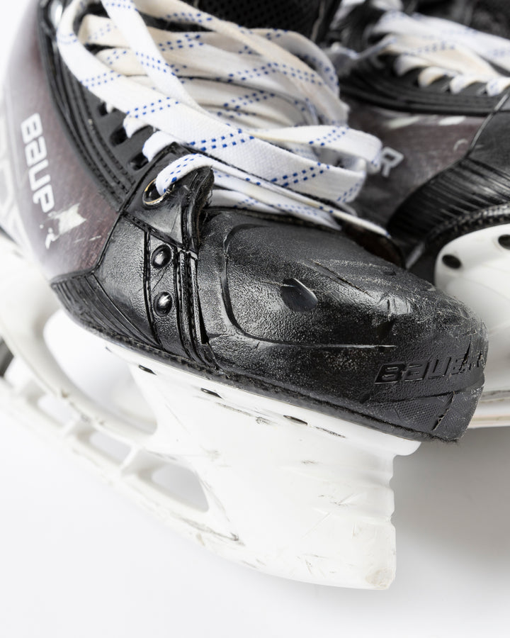 black Bauer hockey skates worn by Chicgo Blackhawks player Philipp Kurashev - front detail lay flat