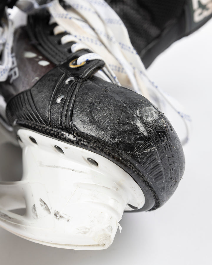 black Bauer hockey skates worn by Chicgo Blackhawks player Philipp Kurashev - front detail lay flat