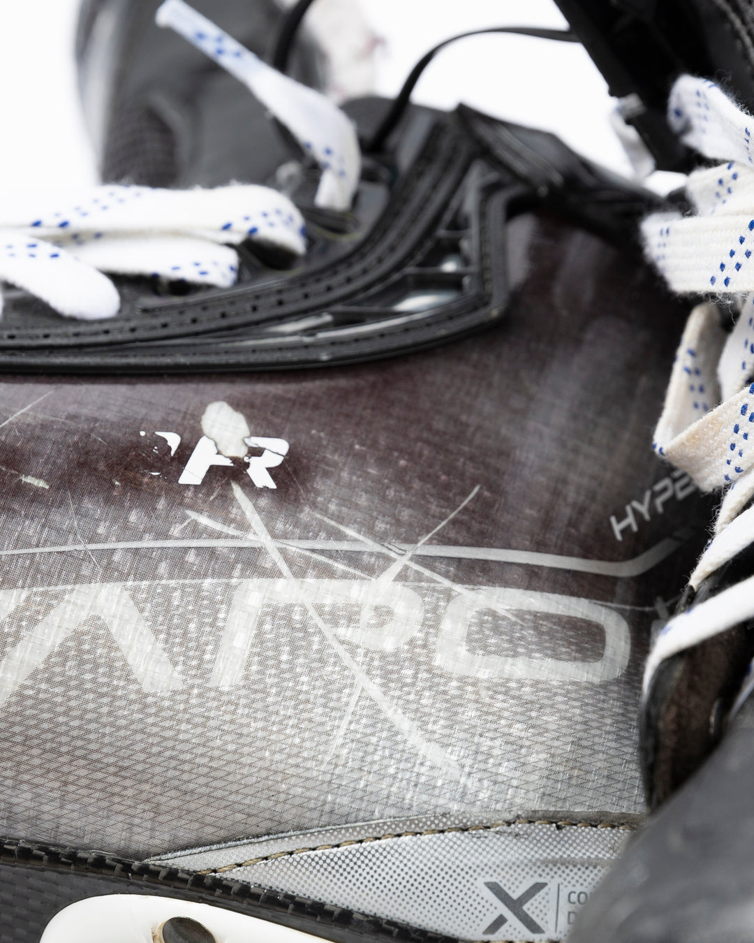 black Bauer hockey skates worn by Chicgo Blackhawks player Philipp Kurashev - side detail lay flat