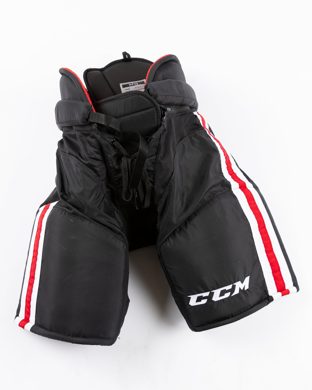 black CCM hockey pants used by unspecified Chicago Blackhawks player - front lay flat