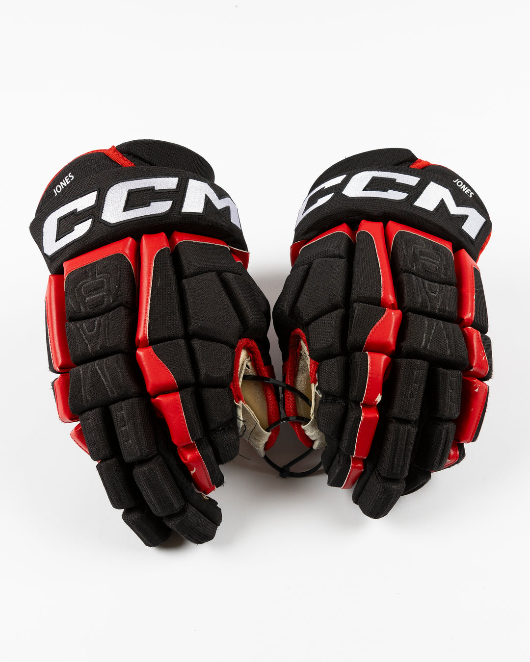 black CCM hockey gloves used by Chicago Blackhawks player Seth Jones - front lay flat