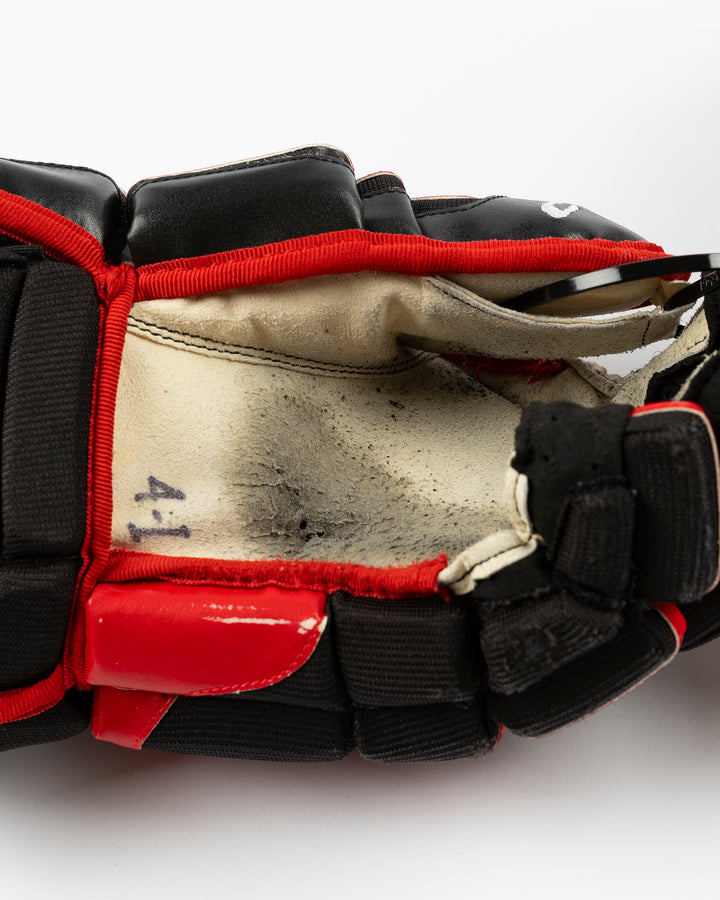 black CCM hockey gloves used by Chicago Blackhawks player Seth Jones - alt palm detail lay flat