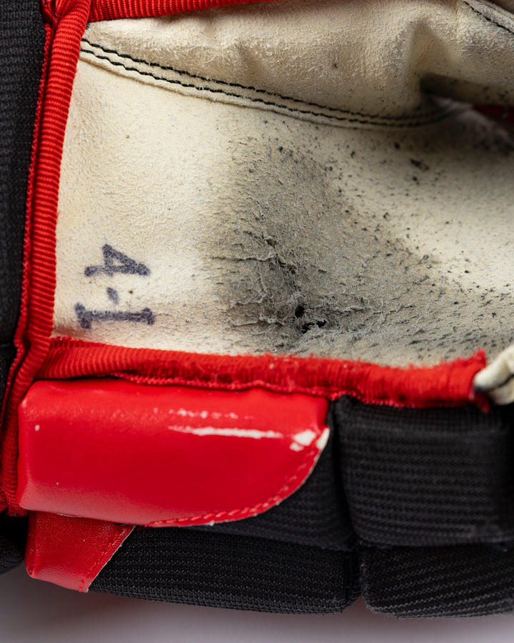 black CCM hockey gloves used by Chicago Blackhawks player Seth Jones - scuffing detail lay flat