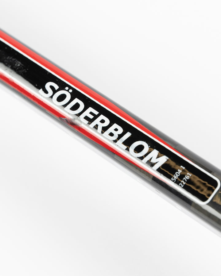 black TRUE hockey stick used by Chicago Blackhawks goalie Arvid Soderblom - name detail lay flat