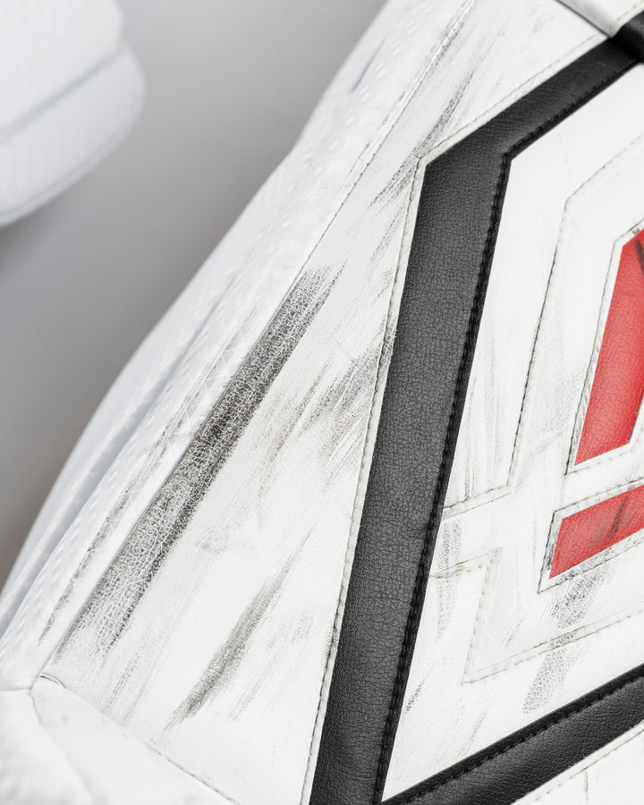 white Vaughn goalie pads used by Chicago Blackhawks goalie Petr Mrazek - alt scuff detail lay flat