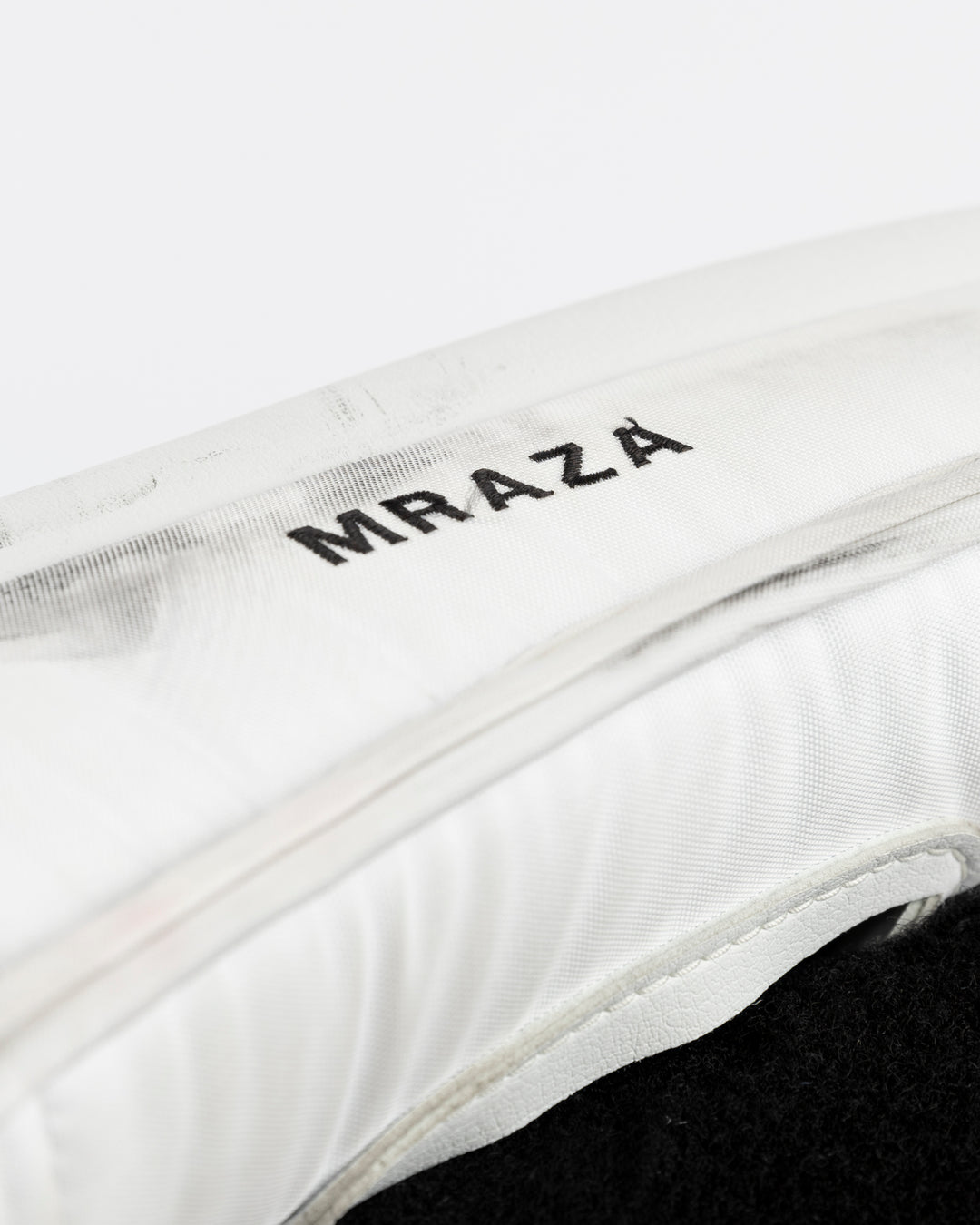 white Vaughn goalie pads used by Chicago Blackhawks goalie Petr Mrazek - name detail lay flat