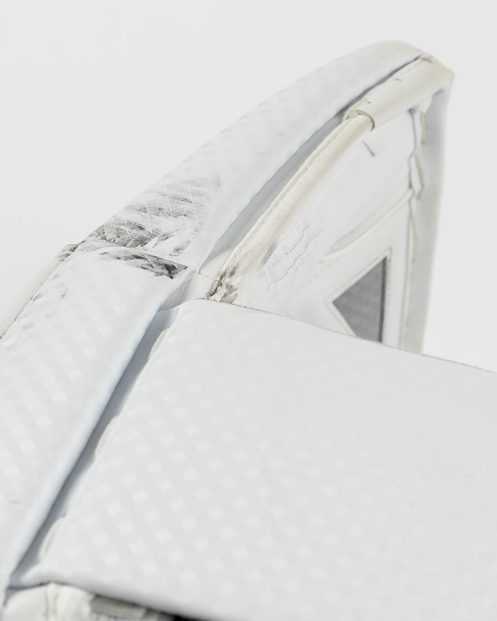 white Vaughn goalie pads used by Chicago Blackhawks goalie Petr Mrazek - scuff detail lay flat