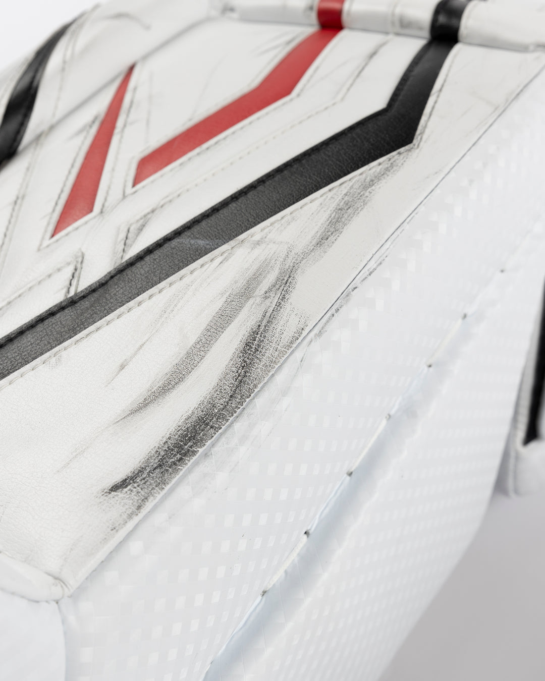 white Vaughn goalie pads used by Chicago Blackhawks goalie Petr Mrazek - alt scuff detail lay flat