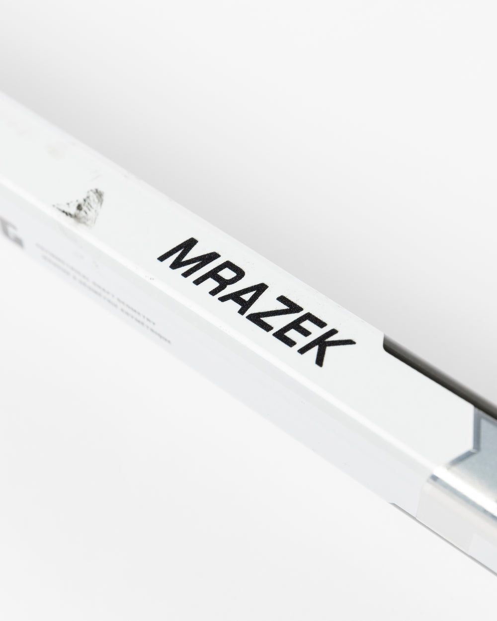 Warrior brand hockey stick used by Chicago Blackhawks goalie Petr Mrazek - name detail lay flat