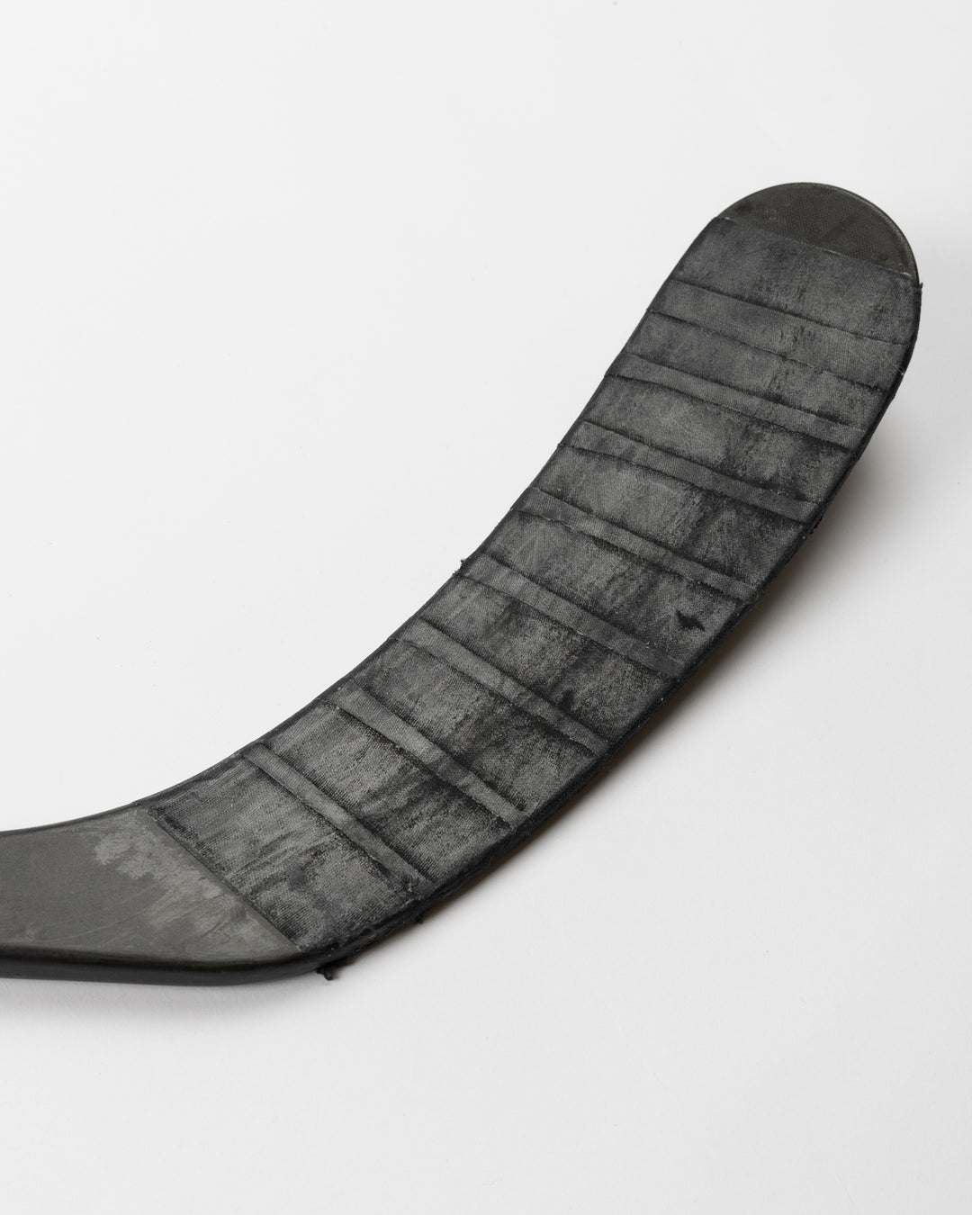 black CCM hockey stick used by Chicago Blackhawks player Taylor Hall - end of stick detail lay flat